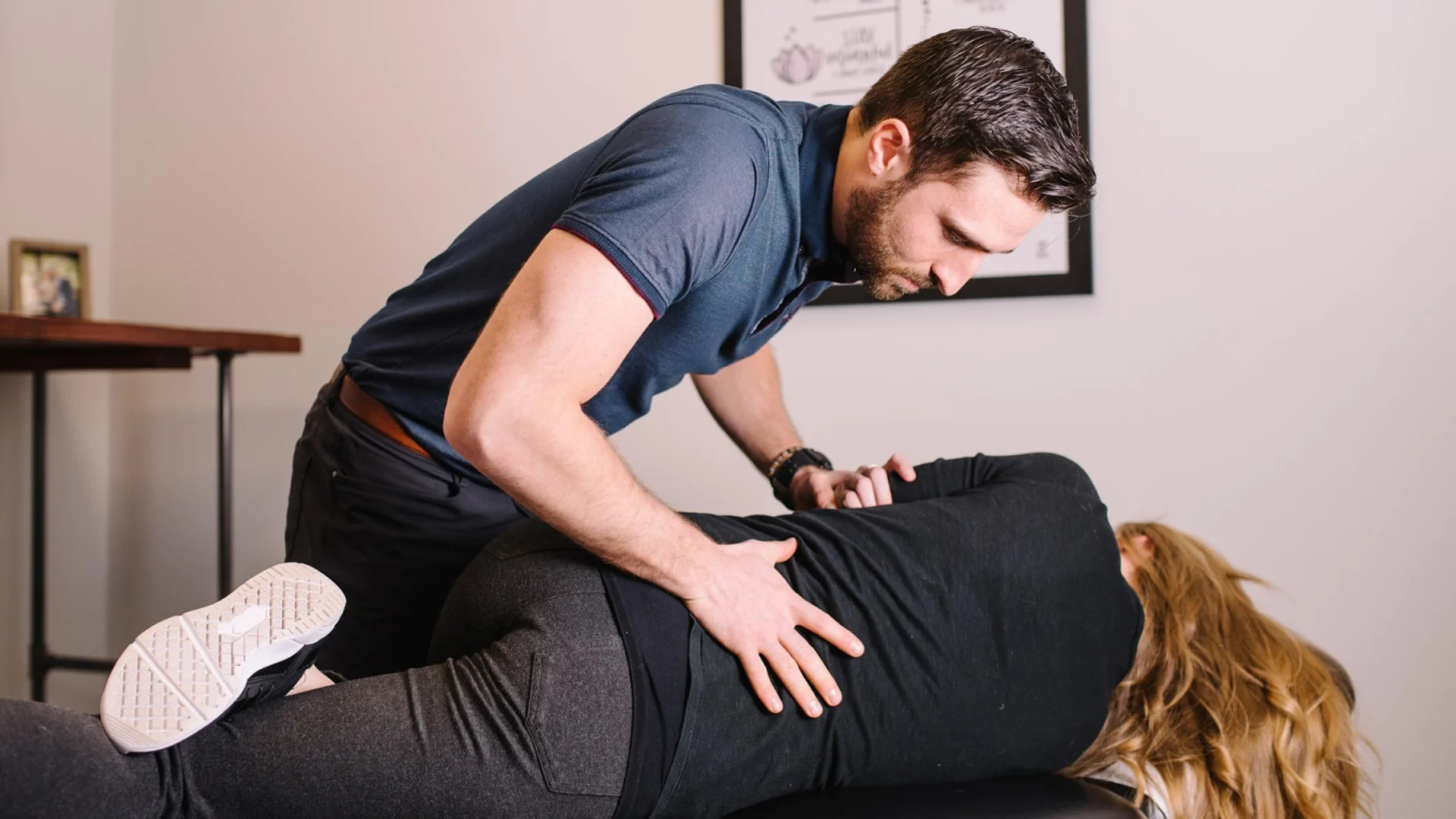 doctor doing some chiropractic execises on a client